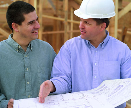 homeowner and builder discussing changes to a house plan