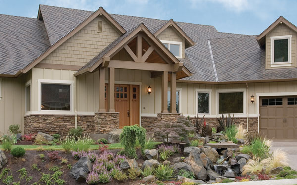 rustic Craftsman style home with natural landscaping