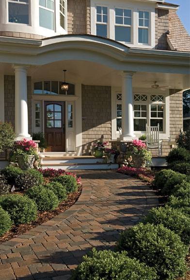 inviting front entry with flowers and attractive walkway