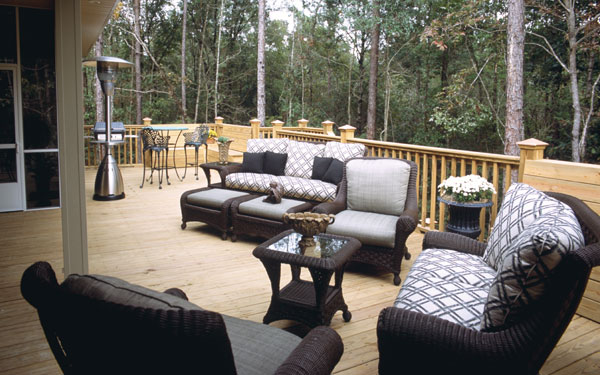 sprawling deck with comfortable outdoor furniture
