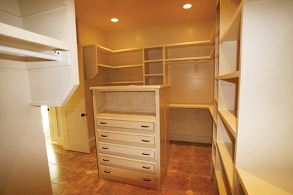 empty oversized luxury style master bedroom closet