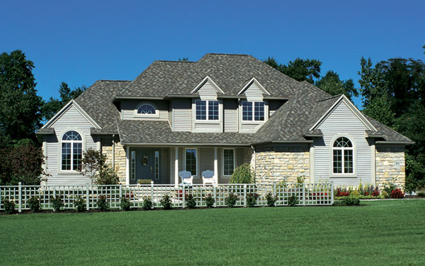 Traditional two-story home design with attractive front yard fence