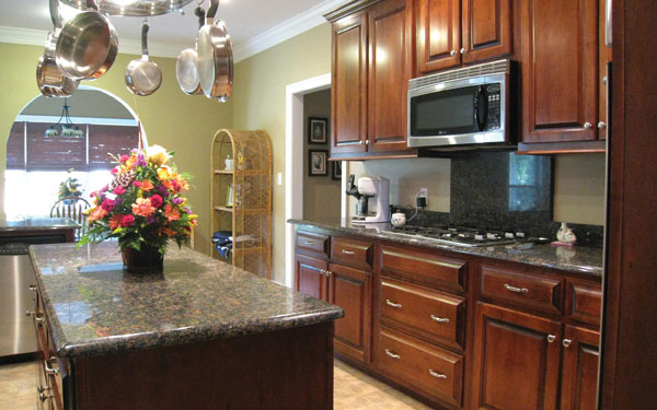 Traditional style kitchen with fresh colorful flower arrangement
