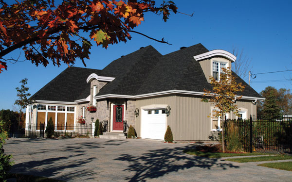 Country French house deisn with permeable paver driveway Country French house deisn with permeable paver driveway