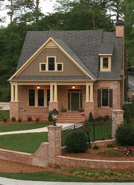 Craftsman style house plan with stylish brick and wrought iron fence