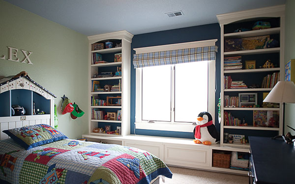 stylish children's bedroom with bookshelves