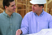 homeowner with contractor reviewing blueprints