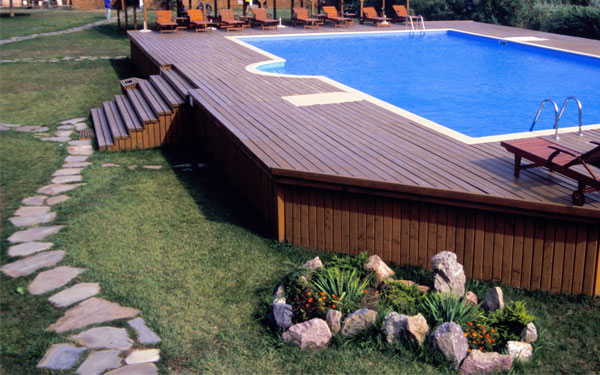 above ground pool with a stepping stone path
