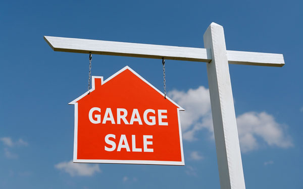 bright red garage sale sign