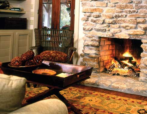 warm fireplace with fall decor