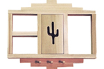 This curio shelf has a carved cactus designin the center and three pegs across the bottom