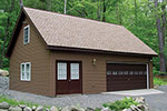 Oversized two-car garage features a double door and multiple windows for added light inside