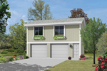 Two-story apartment garage has charming window boxes on both of the windows above the garage doors
