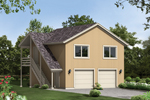 Two-story apartment garage has Western style roof and side stairs to the second floor