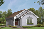 Two-car garage has the look of a home on the outside with a covered front porch and window box
