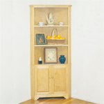 A handy corner cabinet provides an ideal spot for displaying collectibles without taking up much space