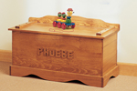 Old-fashioned wood toy chest includes a place for personalizing 