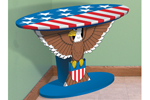 This patriotic table has a bald eagle design as the stand with a stars and stripes pattern on the top