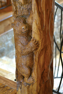 staircase detail with carved wood bear