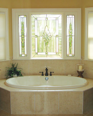 beautiful stained glass window above whirlpool tub