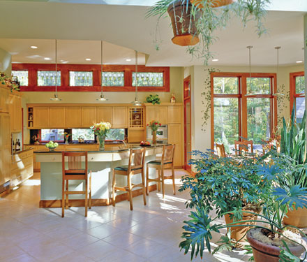 open kitchen floor plan with many plants and skylights