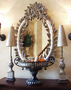Formal oval mirror with table in front