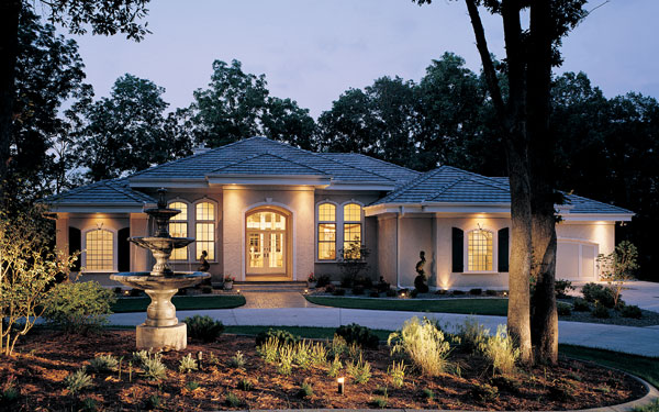 luxury ranch home with stucco exterior