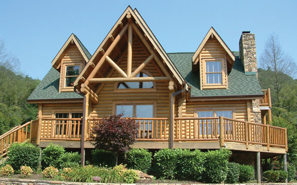 log cabin home with wrap-around porch