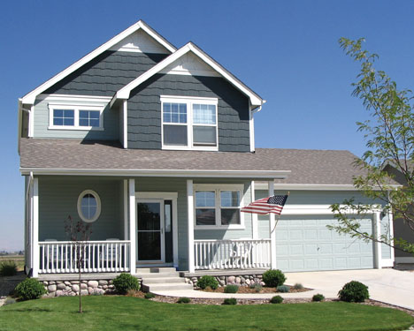 craftsman style home with American flag flying