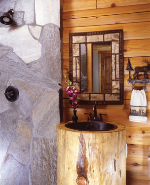 bathroom with stone shower and log sink