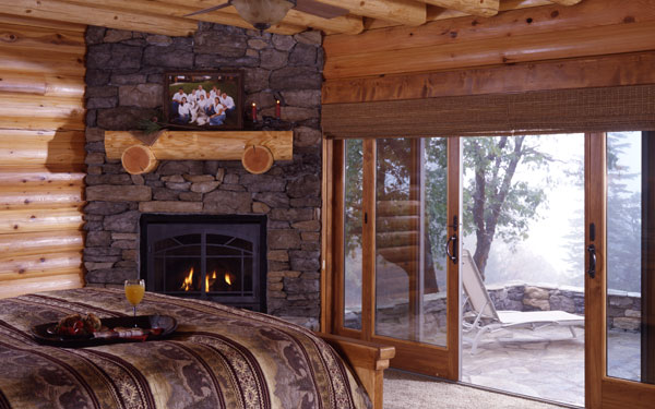 log home master bedroom with view