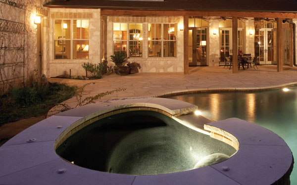 hot tub built into swimming pool design
