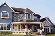 Victorian home with American flags thumbnail Victorian home with American flags thumbnail