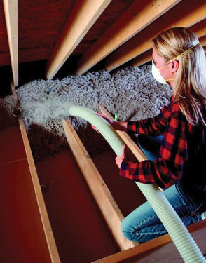 woman adding insulation to her home