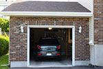 photo of brick home with a 1-car garage