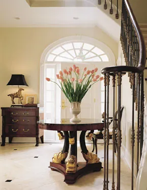 entry foyer with dramtic flower arrangement