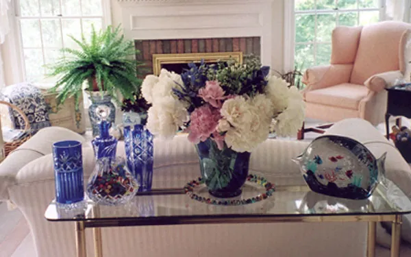 Light and airy hearth with large bouquet of peonies in a vase