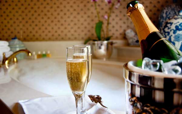 champagne by a bathtub