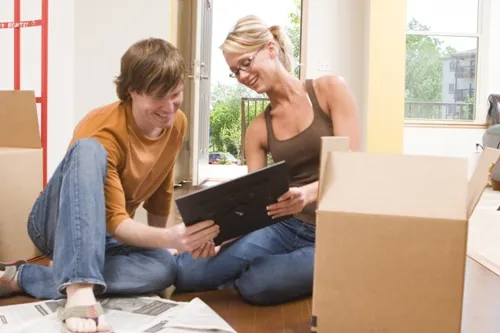 couple packing moving boxes