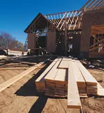 two-story house plan under construction