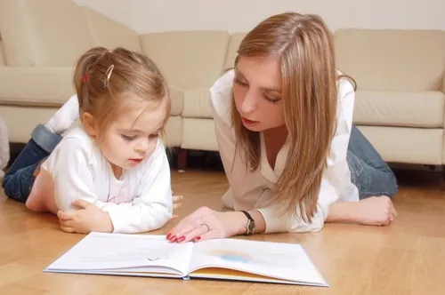 mother and daughter sitting on floor