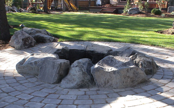 a fire pit with boulders