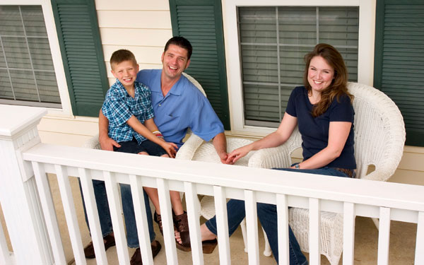 couple and child on porch